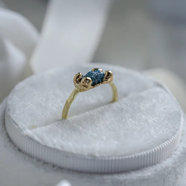 Gold ring with blue raw diamond and hammered surface SEA Image