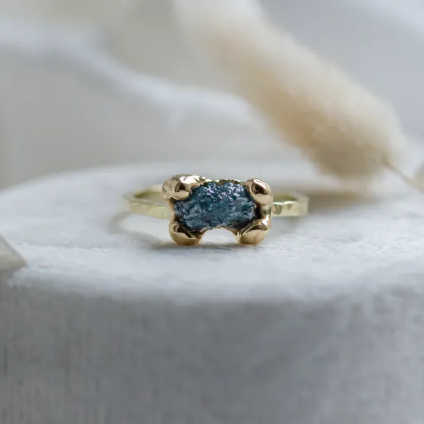 Gold ring with blue raw diamond and hammered surface SEA Image