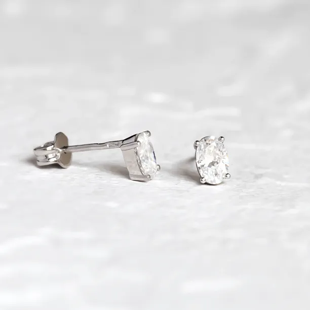 Gold minimalist earrings with oval lab-grown diamonds CARO Image