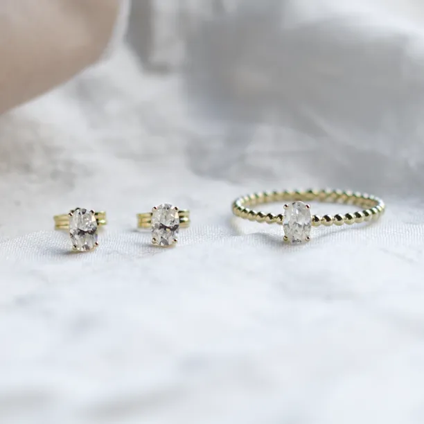 Gold minimalist earrings with oval lab-grown diamonds CARO Image