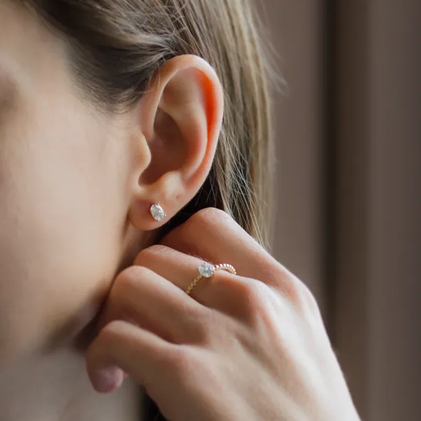 Gold minimalist earrings with oval moissanites CAROLYNE Image