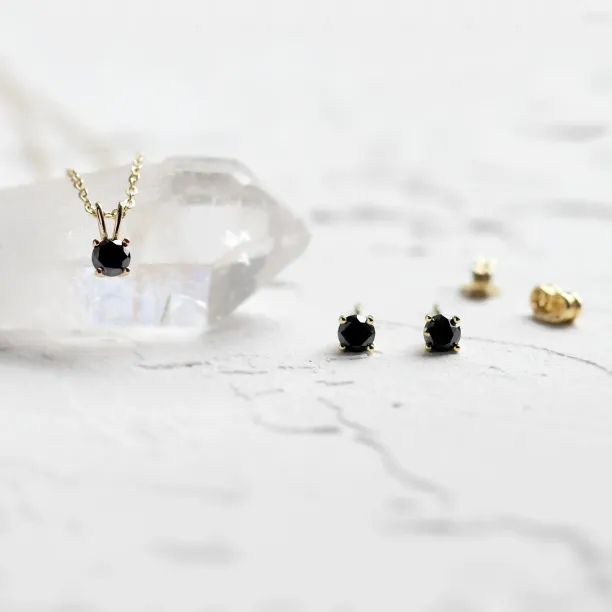 Gold pendant and earrings with black diamonds BLADETTE Image