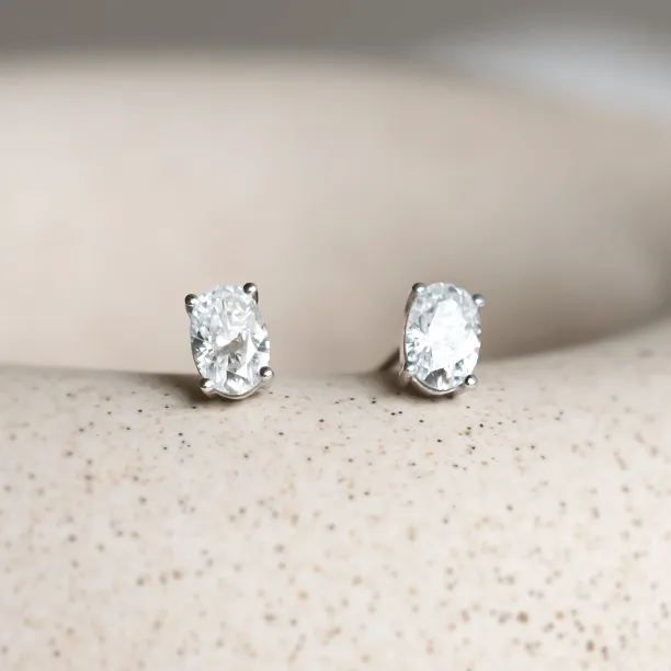Gold minimalist earrings with oval lab-grown diamonds CARO Image