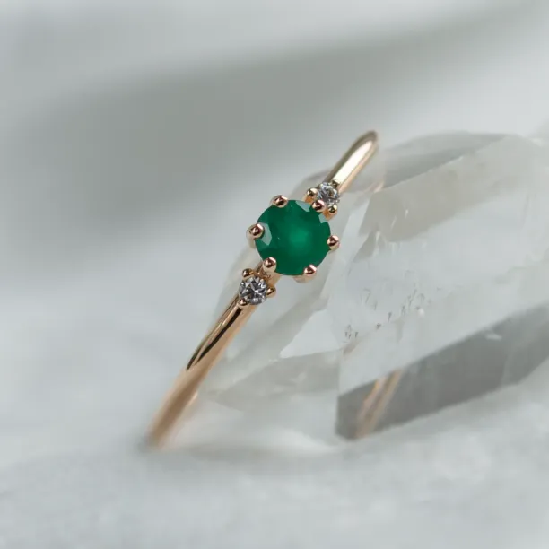 Engagement ring with emerald and side diamonds AVA Image