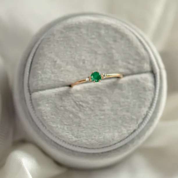 Engagement ring with emerald and side diamonds AVA Image