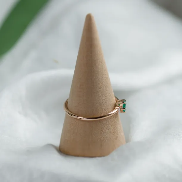 Engagement ring with emerald and side diamonds AVA Image