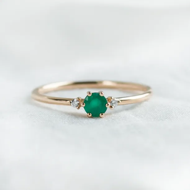 Engagement ring with emerald and side diamonds AVA Image