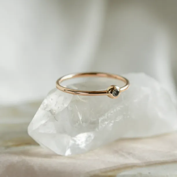 Minimalist engagement ring with salt and pepper diamond in bezel style FLAIR Image