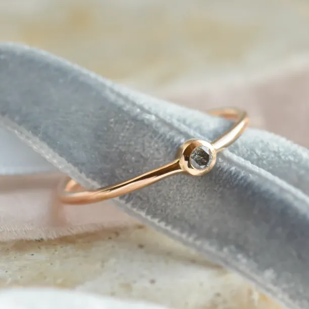 Minimalist engagement ring with salt and pepper diamond in bezel style FLAIR Image