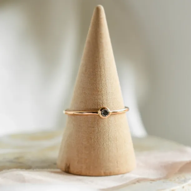 Minimalist engagement ring with salt and pepper diamond in bezel style FLAIR Image