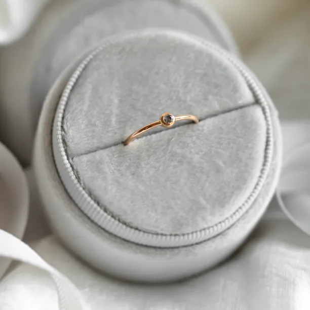 Minimalist engagement ring with salt and pepper diamond in bezel style FLAIR Image