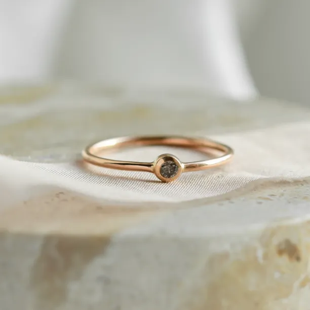 Minimalist engagement ring with salt and pepper diamond in bezel style FLAIR Image