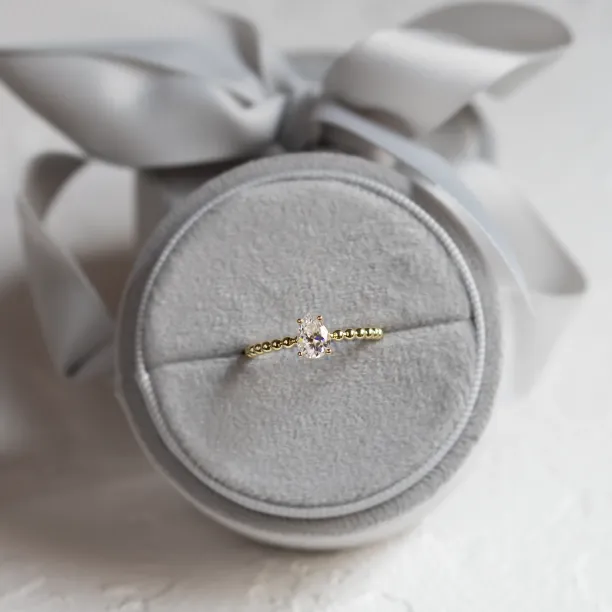 Gold engagement ring with beaded ball setting and pear moissanite BEAU Image