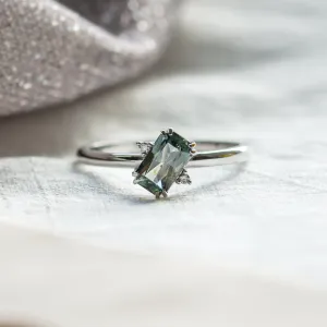 Gold ring with radiant teal sapphire and side diamonds JOY