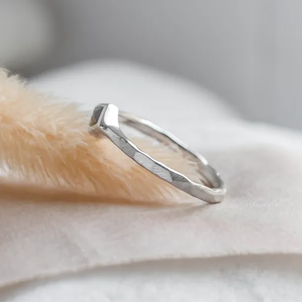 Ring with hammered surface and salt and pepper diamond DART Image