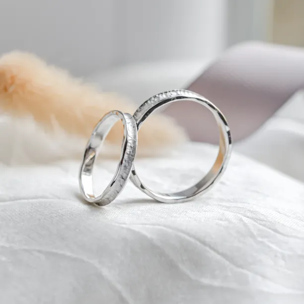 Gold wedding bands with rustical surface STRETTA Image