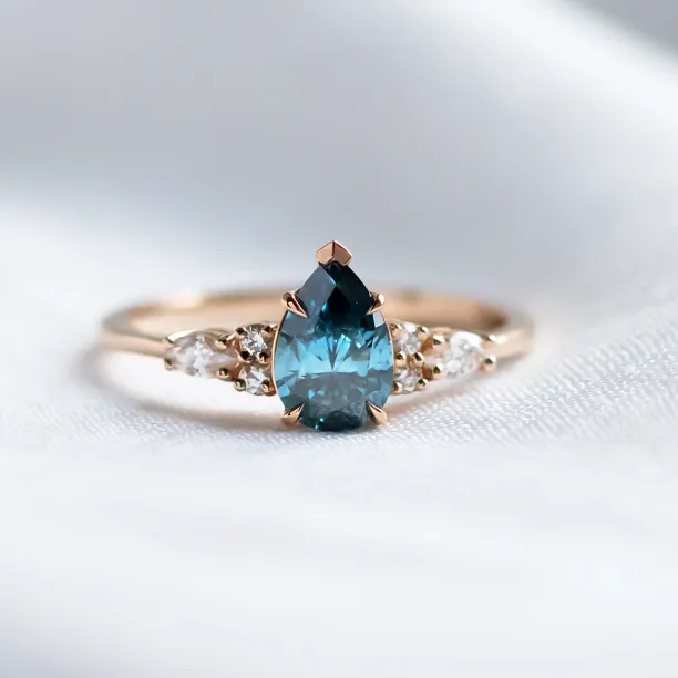 Gold ring with pear blue lab grown diamond and side diamonds AZURE Image