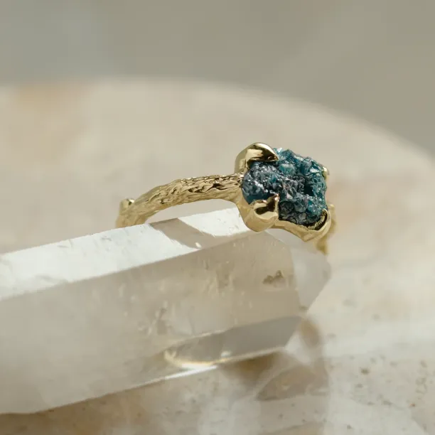 Gold ring with blue raw diamond and unusual rim SKY Image