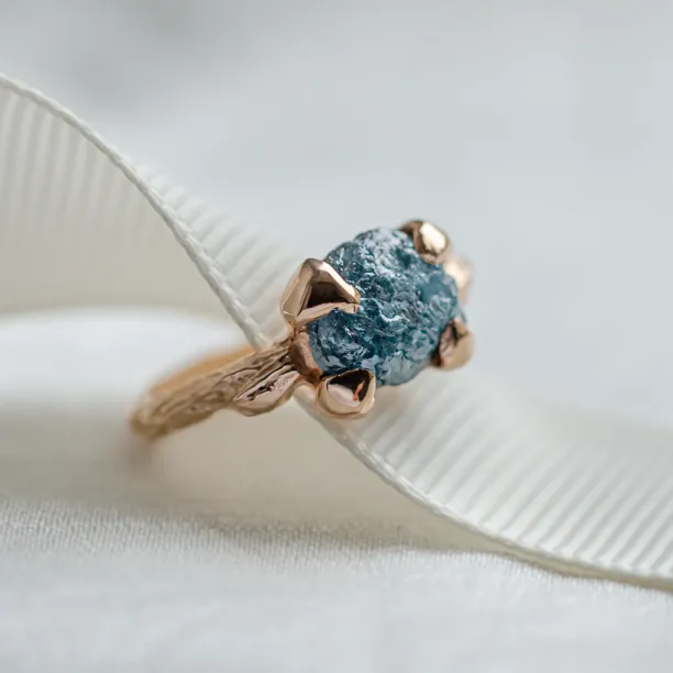 Gold ring with blue raw diamond and unusual rim SKY Image
