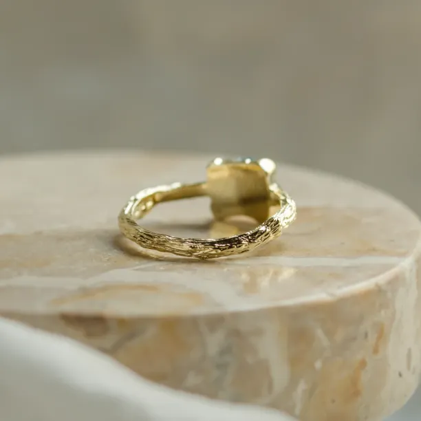 Gold ring with blue raw diamond and unusual rim SKY Image