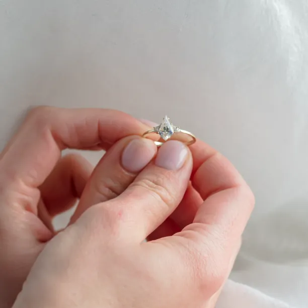 Elegant engagement ring with kite moissanites DOMPHI Image