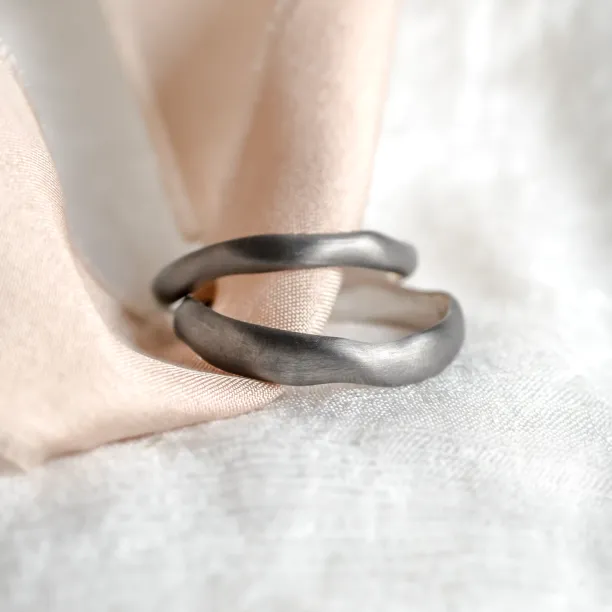 Black curved wedding rings SHALE Image