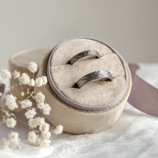 Black wedding rings with woodbark surface EBEN Image