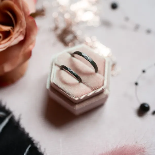 Black wedding bands in gold with hammered surface AZTEK Image