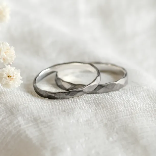 Black wedding bands in gold with hammered surface AZTEK Image