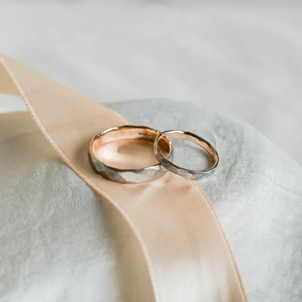 Black wedding bands in gold with hammered surface AZTEK Image