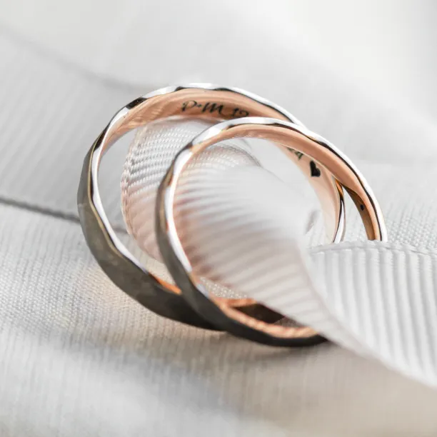 Black wedding bands in gold with hammered surface AZTEK Image