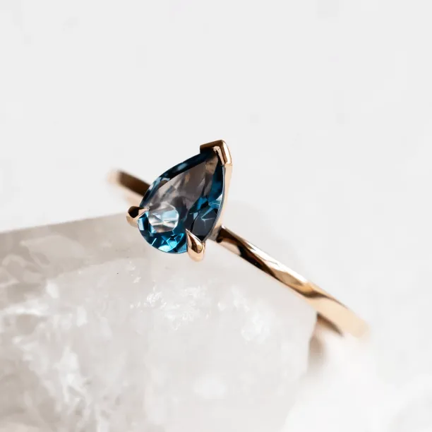 Gold ring with london blue topaz DROP Image