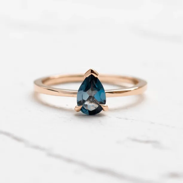 Gold ring with london blue topaz DROP Image