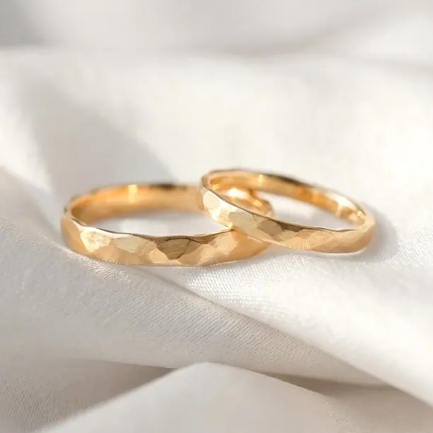 Matte gold wedding bands with hammered surface ETAIN Image