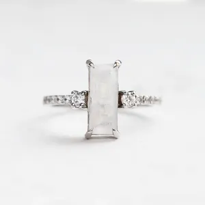 Gold baguette moonstone ring with side diamonds TIGE