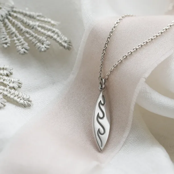 Silver pendant with engraving of waves  ALOHA Image
