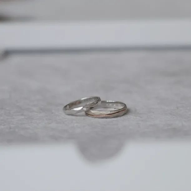 Gold wedding rings with a diamond SILA Image