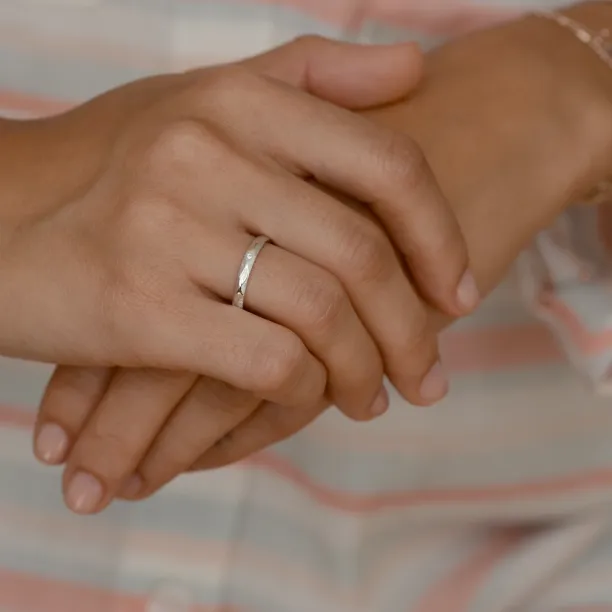 Gold wedding rings with a diamond SILA Image