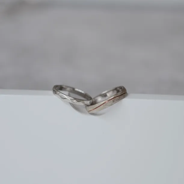 Gold wedding rings with a diamond SILA Image