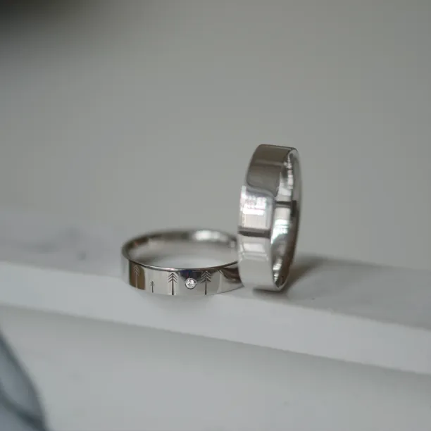 Gold wedding rings with engraved trees FORI Image