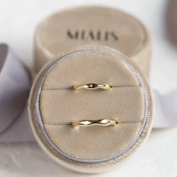 Wavy gold wedding rings with a diamond APRILIA Image