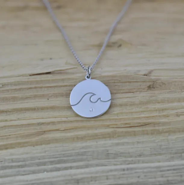 Silver pendant with a diamond SURF Image