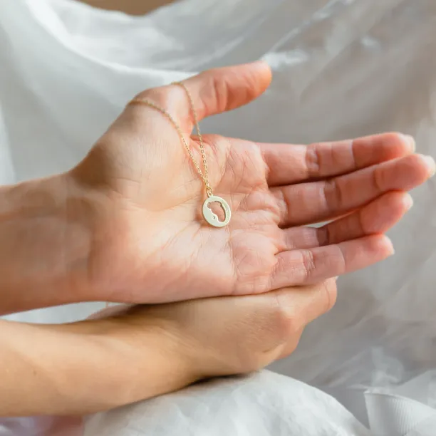 EIIA gold diamond pendant with baby foot trace Image