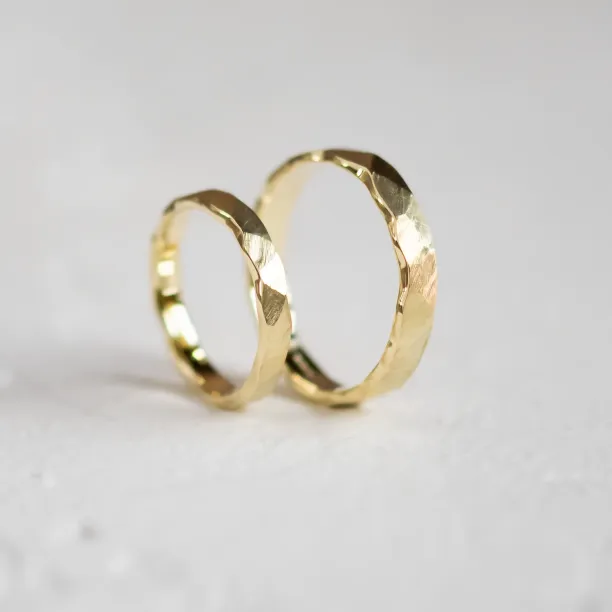 Gold wedding rings with a relief surface TRINVI Image