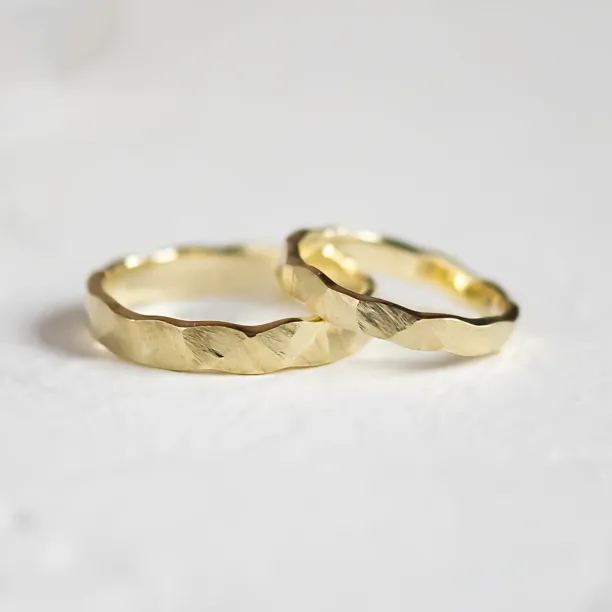Gold wedding rings with a relief surface TRINVI Image