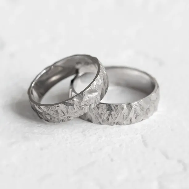 Gold wedding rings with a relief surface FIO Image
